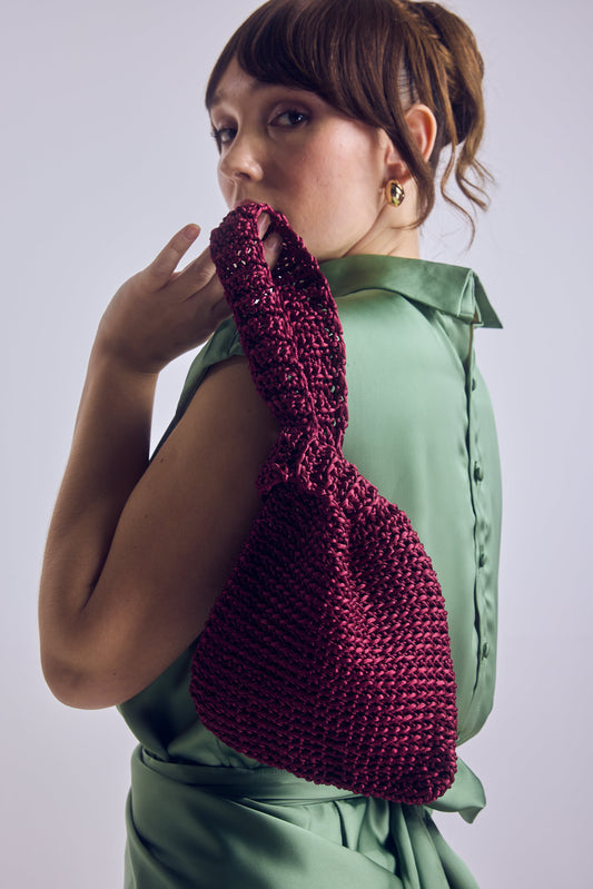 Bolso mano tejido burdeo
